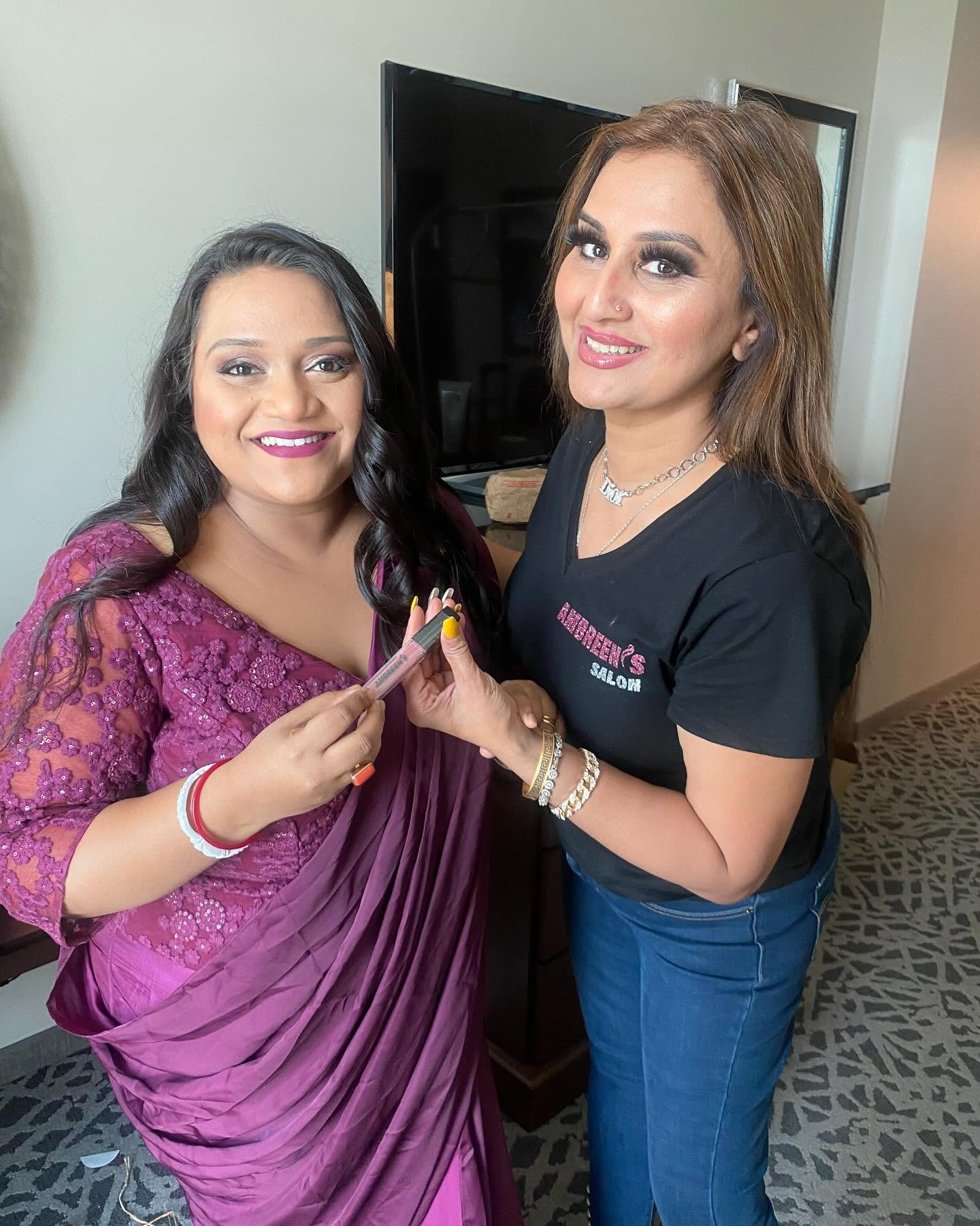 Salon stylist with a client